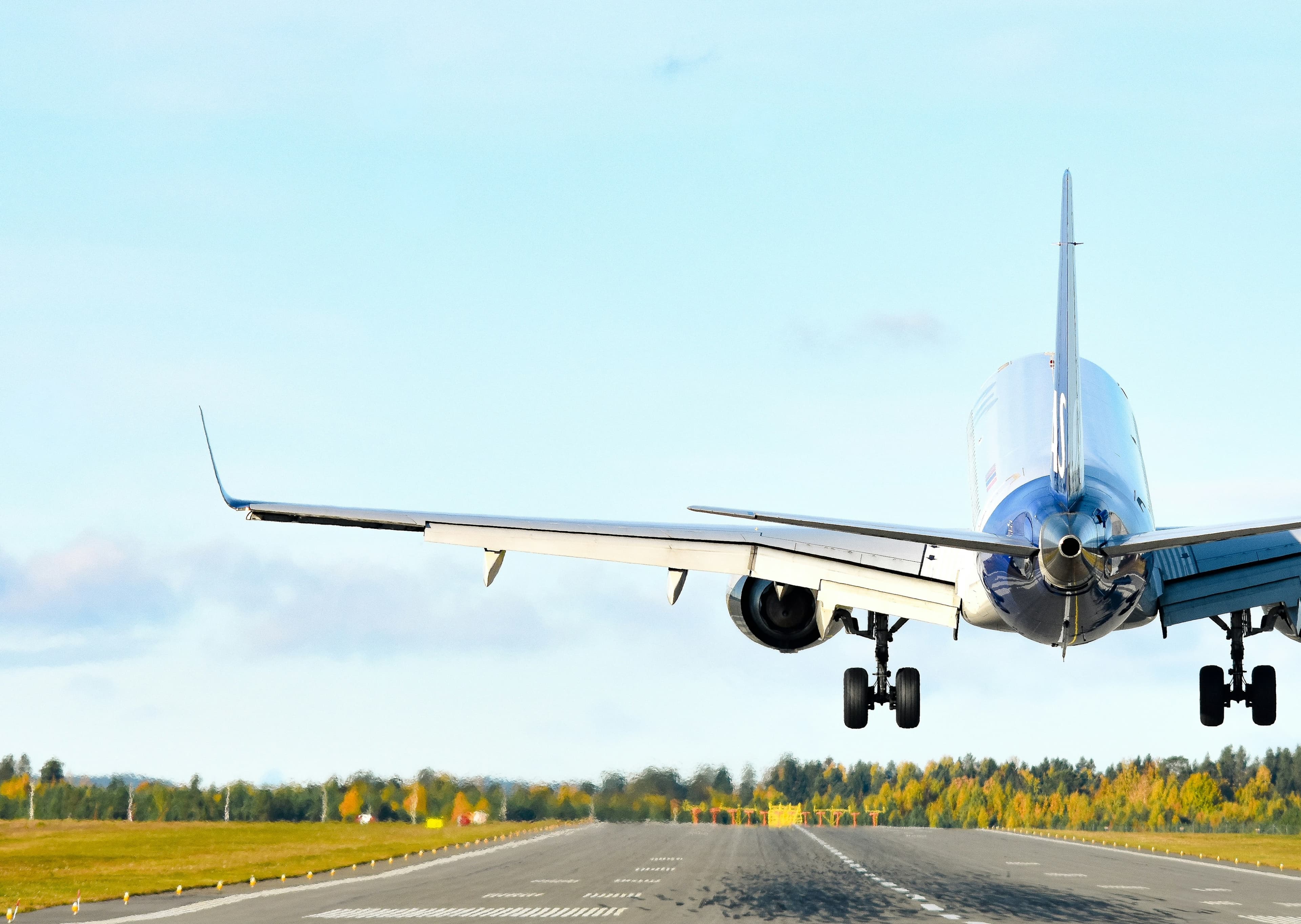 An airliner touching down on a runway